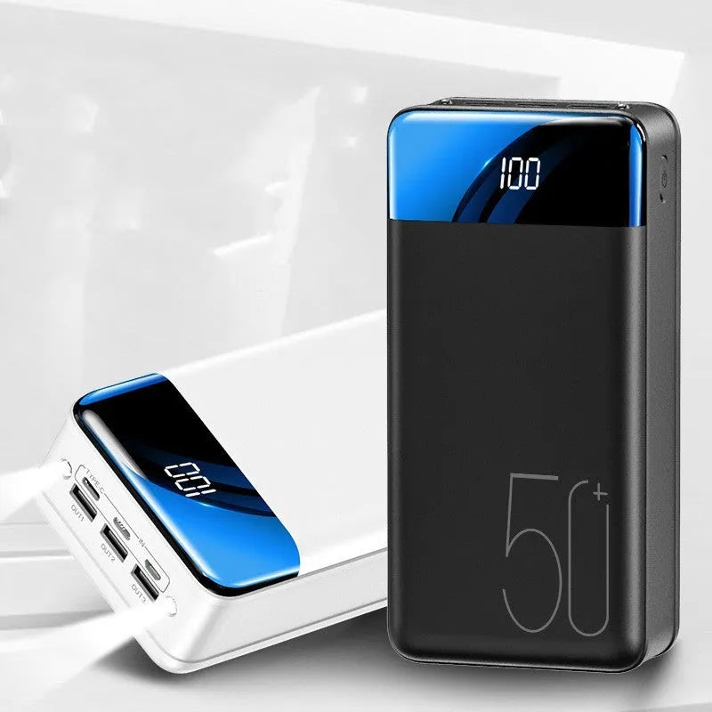 Black and white 50000mAh power bank showing three USB output ports and compact design