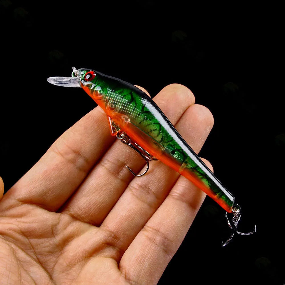43-piece portable fishing gear set with plastic bait lures in green, blue black, and silver colours including 20cm baits