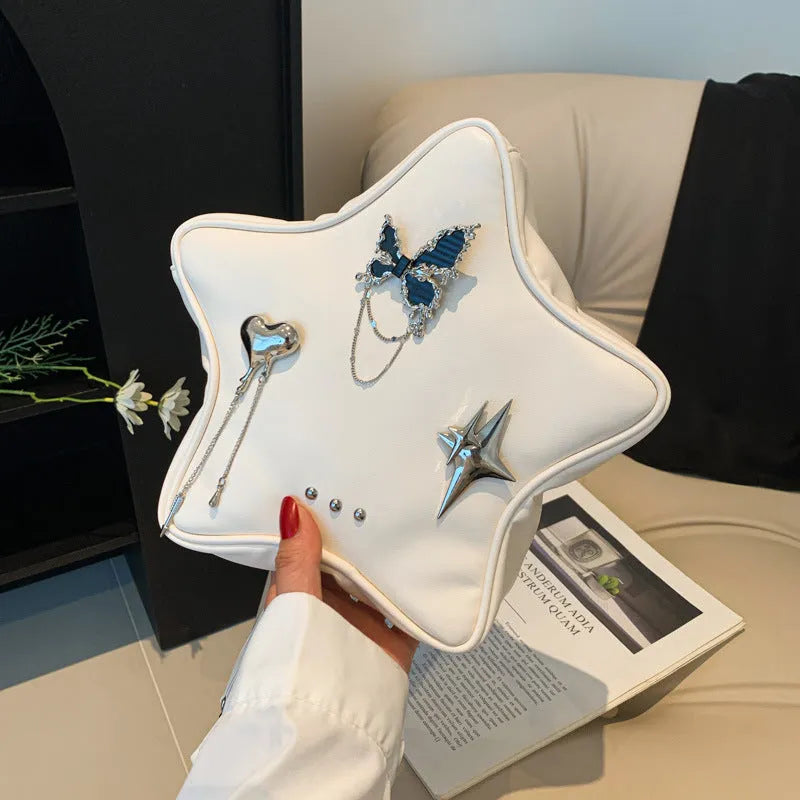 Black women's PU backpack with metal butterfly pendant, chain strap, and an outer 3D pocket.