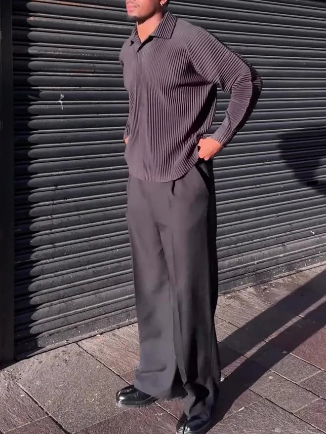 Black men's pleated long-sleeved polyester top showing vertical texture detail