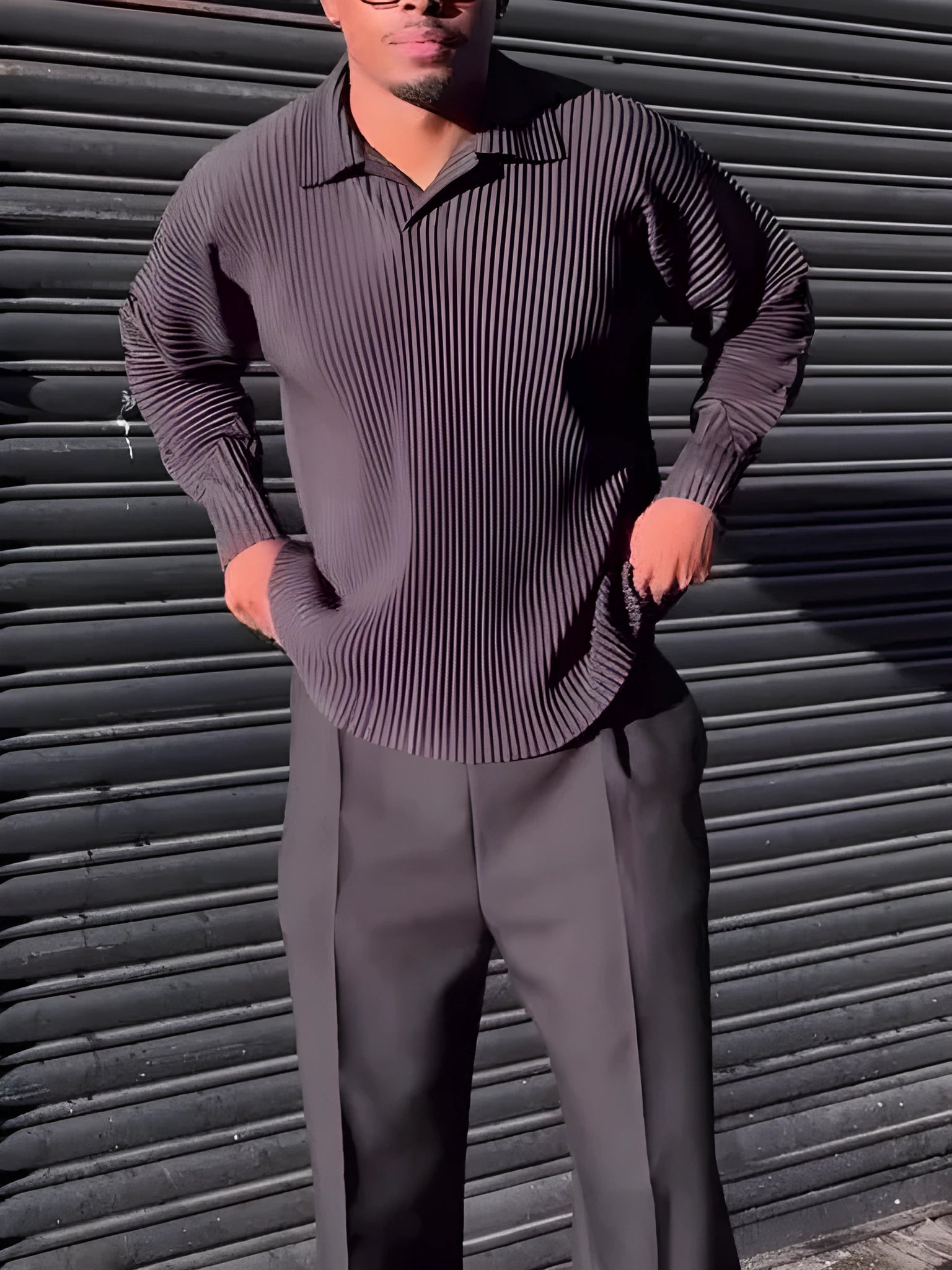 Black men's pleated long-sleeved polyester top showing vertical texture detail
