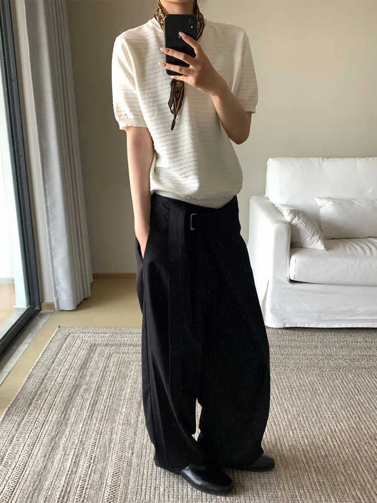 Black straight-leg trousers with adjustable waistband and single-pleat front detail