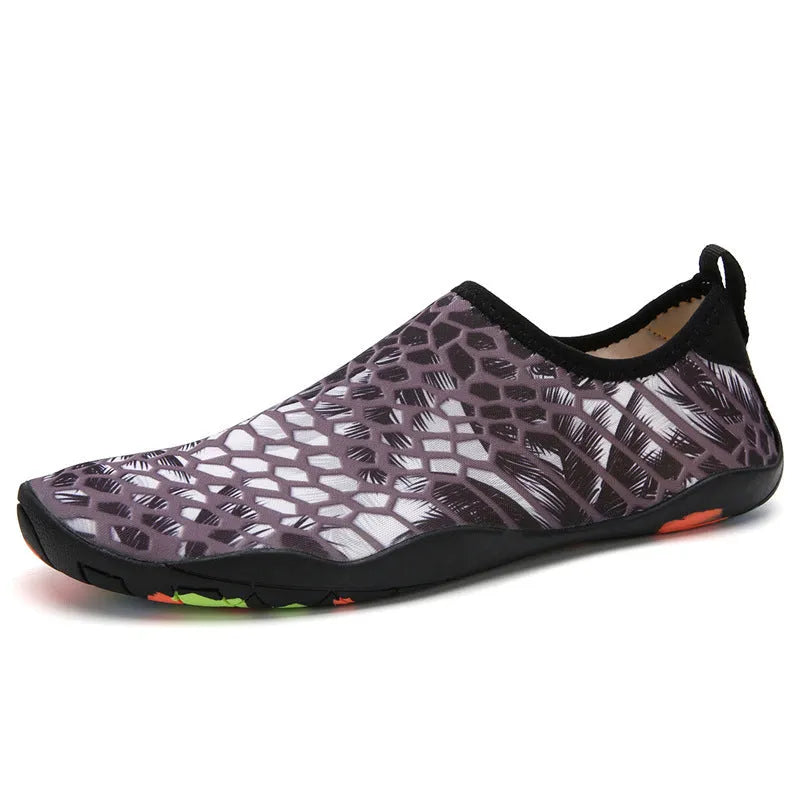 Lycra beach wading shoes with EVA midsole in blue, shown on a sandy shore.
