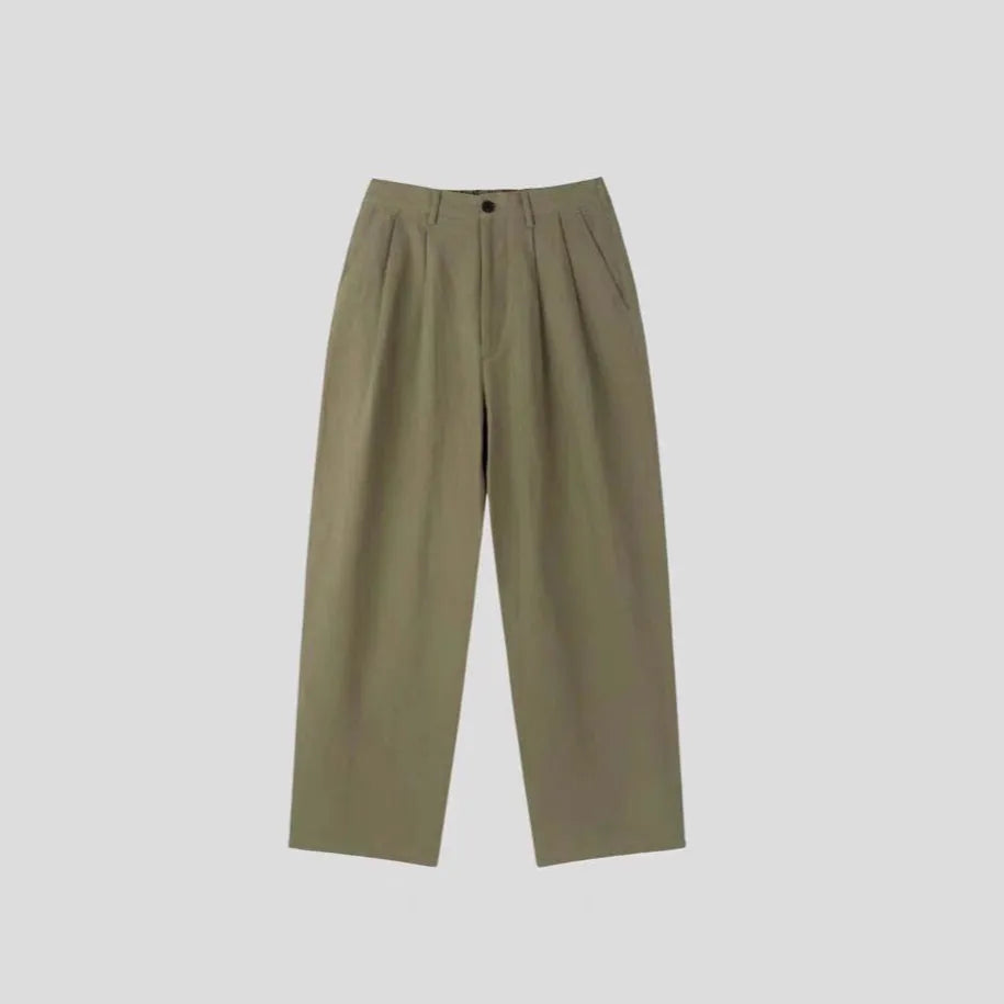 Men's apricot wide-leg cotton linen trousers with a loose fit and pencil leg opening.