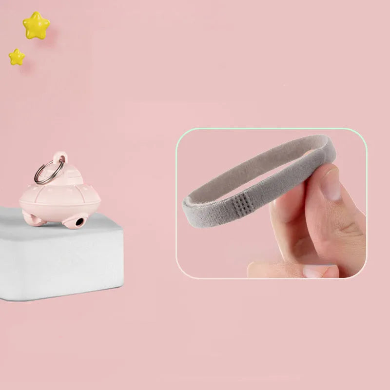Green or pink cat collar laser toy with compact 3cm plastic housing showing USB charging port