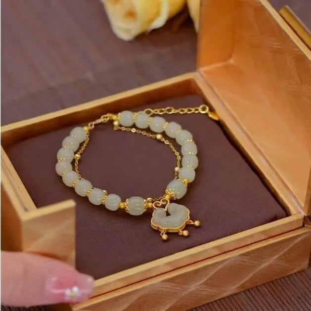Green double-layer women's bracelet with safety lock bell pendant and drop-shaped charm
