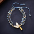 Grey moonstone woven bracelet for women with geometric design and butterfly detailing