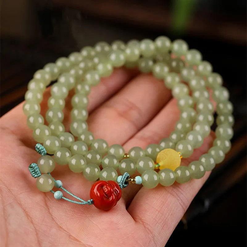 Pale blue Hetian jade bracelet with 6mm beads in three-circle pattern