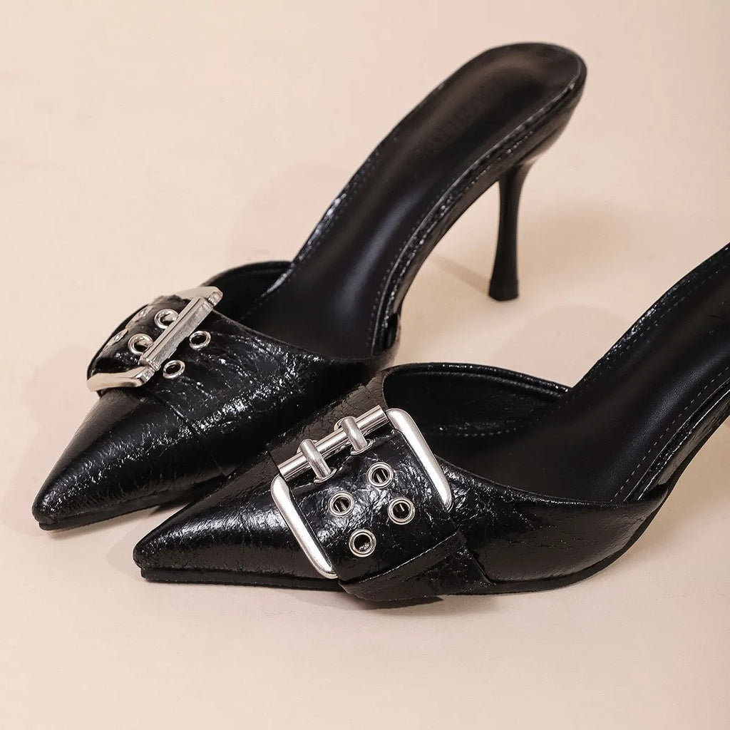 Black women's high heels with pointed toe and buckle strap detail in PU material