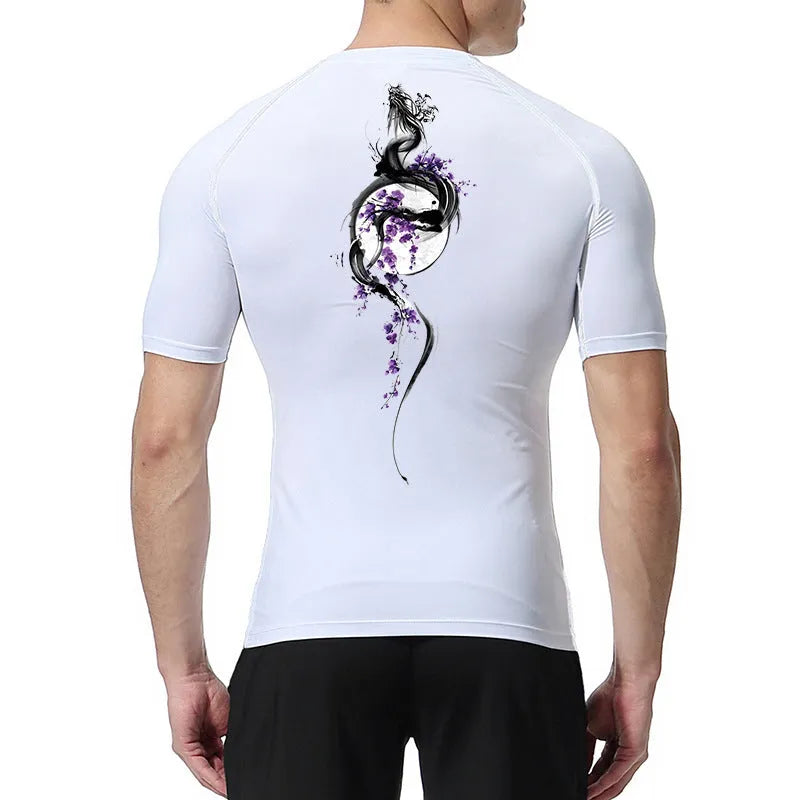 Man wearing a loose-fit short sleeve black shirt with a large white sword graphic print on the front.