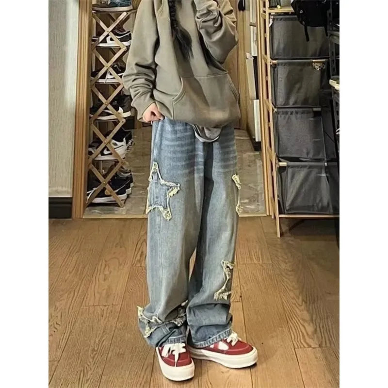 Blue high-waist wide-leg denim jeans with straight-leg fit on hanger