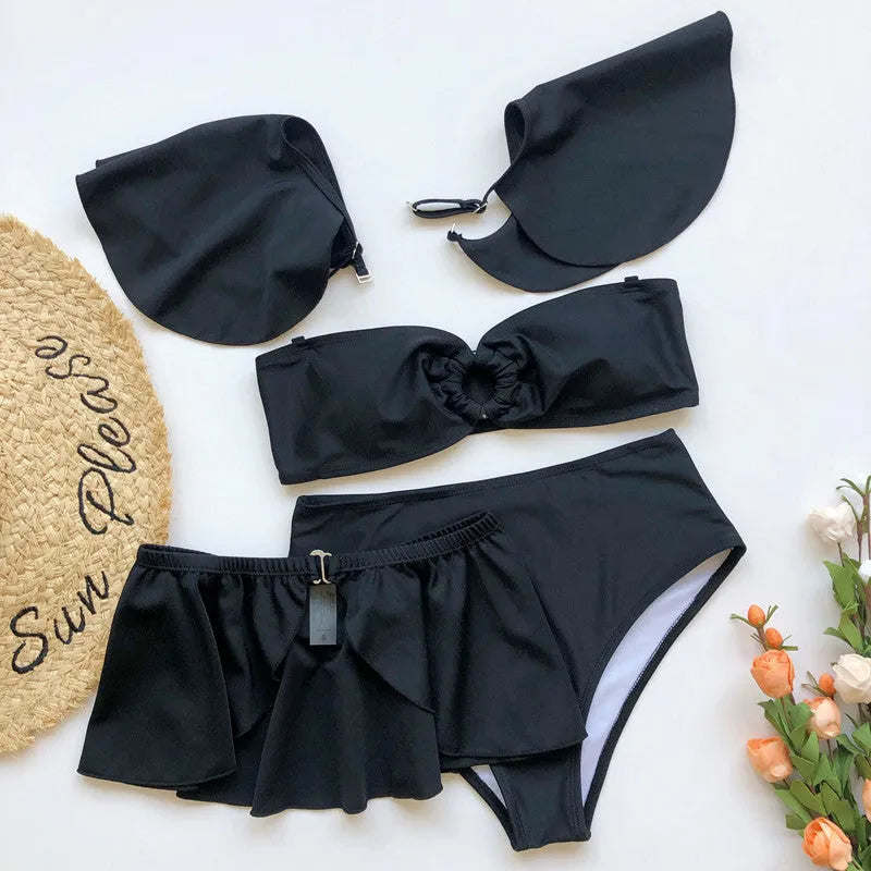 Women's red and black three-piece flounced bikini swimsuit on a hanger.