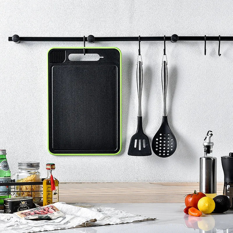 Grey square aluminium cutting board with double-sided design and integrated knife sharpener