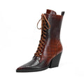 Dark brown retro pointed toe ankle boots with lace detailing and a chunky heel on a white background.