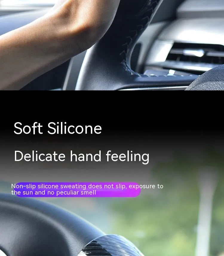 Black silicone steering wheel assistance ball with metal bearing booster installed on car steering wheel