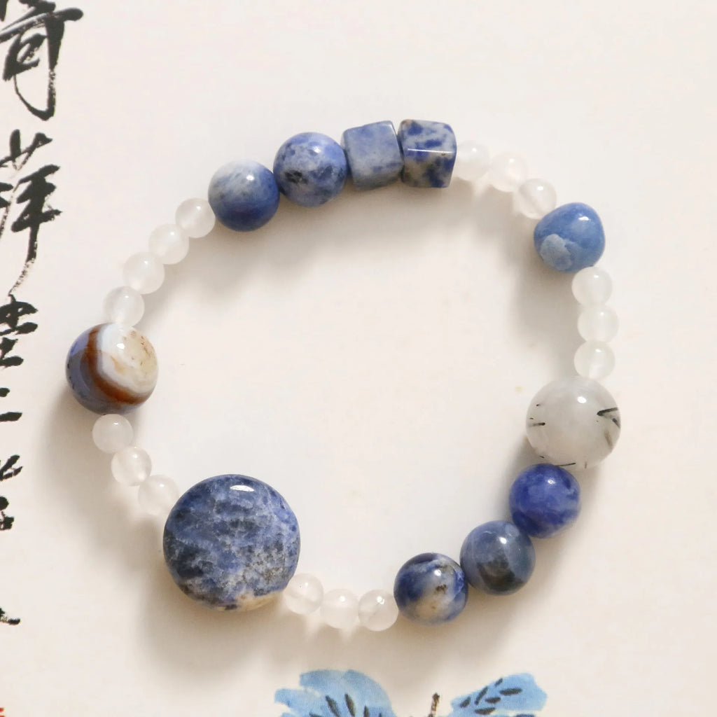 Hand-woven natural blue point and black hair crystal agate bracelet with geometric stone elements