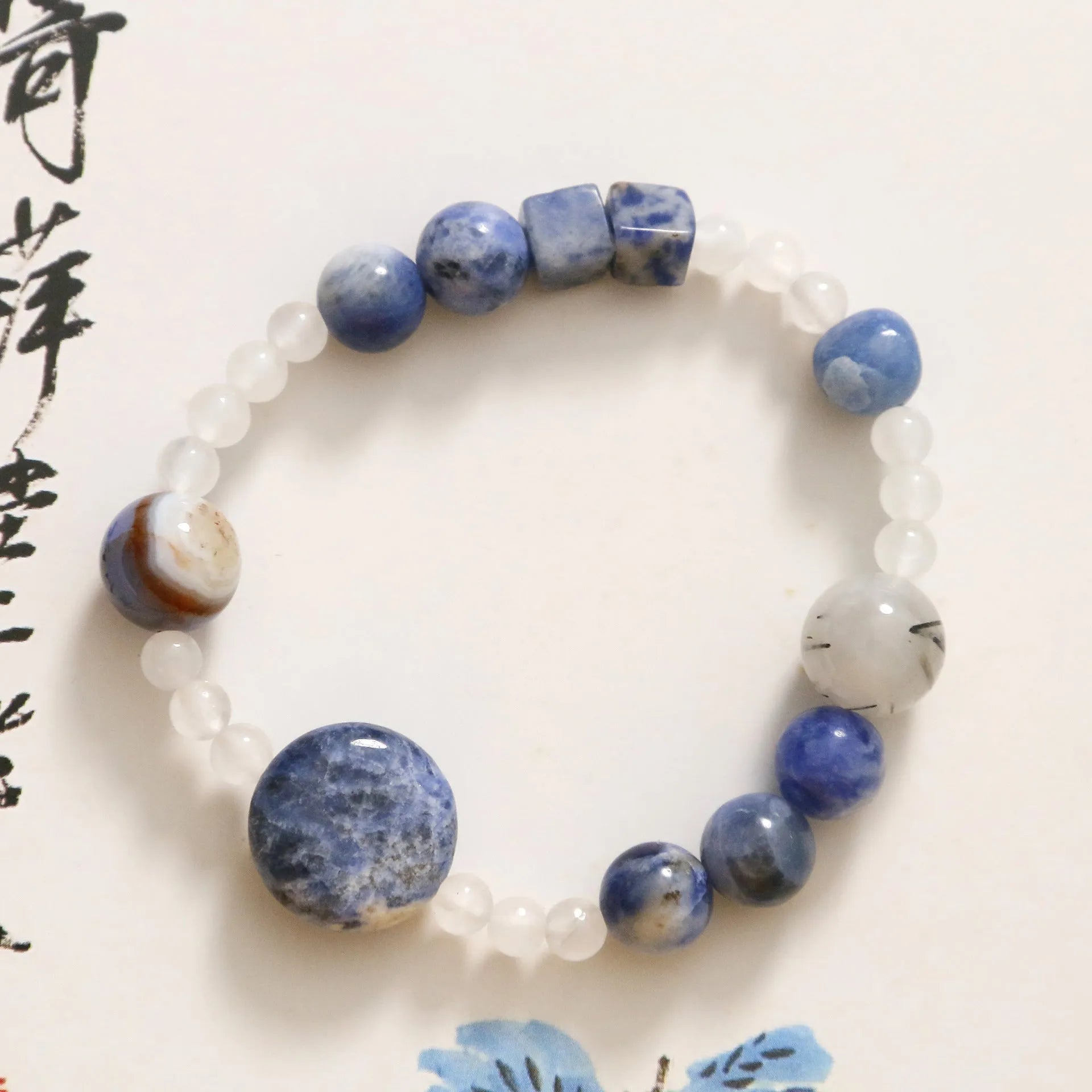 Hand-woven natural blue point and black hair crystal agate bracelet with geometric stone elements