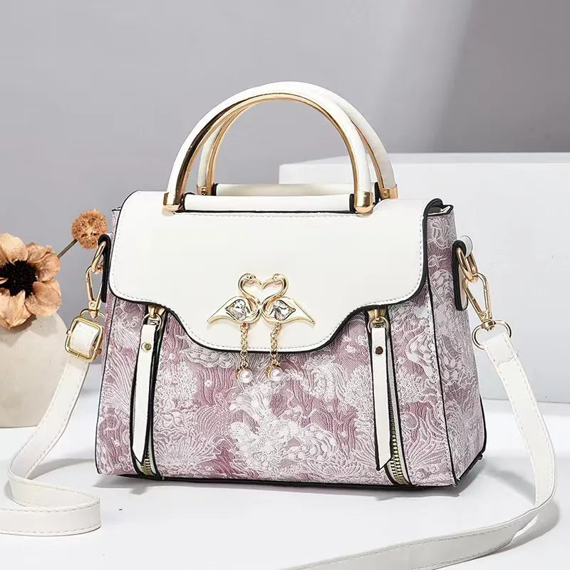 Women's PU crossbody bag in black with woven texture, horizontal square shape, and single shoulder strap