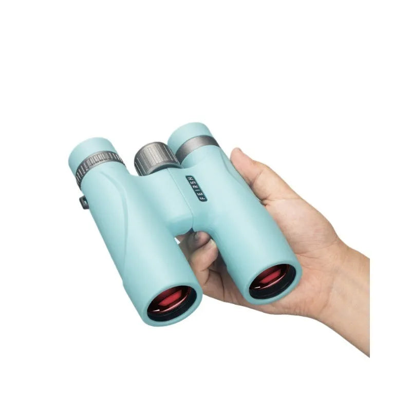 Blue and grey compact 10x32 binoculars with wine red film imaging on a table, showing 112mm size.
