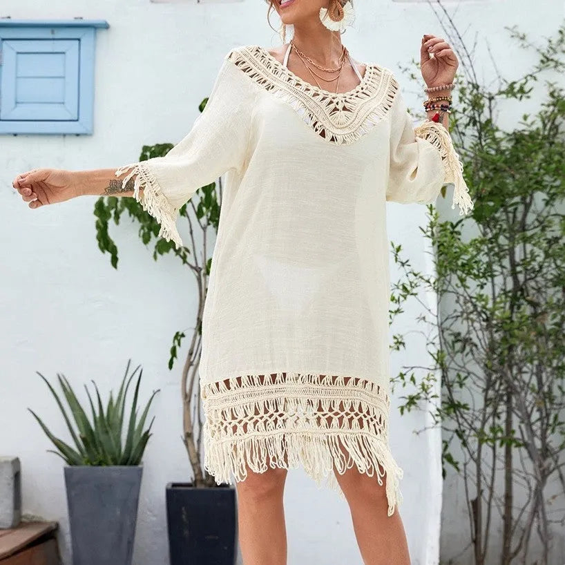 Apricot coloured crocheted patchwork dress with half sleeves and a mid-length hem.