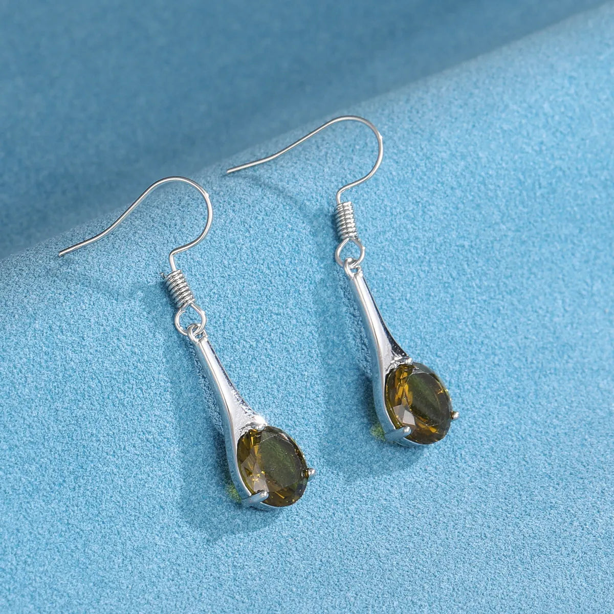 Olive green drop-shaped earrings with retro minimalist design and electroplated alloy construction