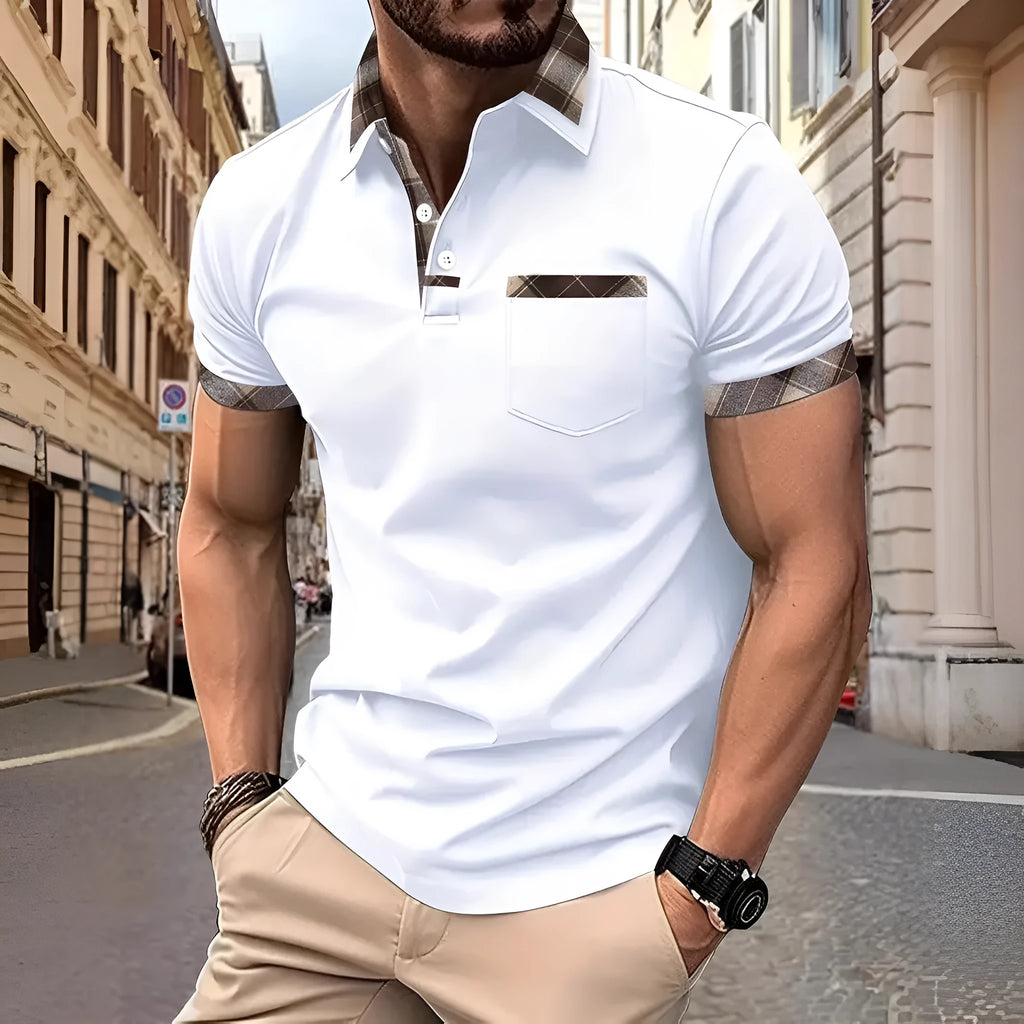Man wearing a loose-fit plaid colourblock short sleeve t-shirt in a summer setting.