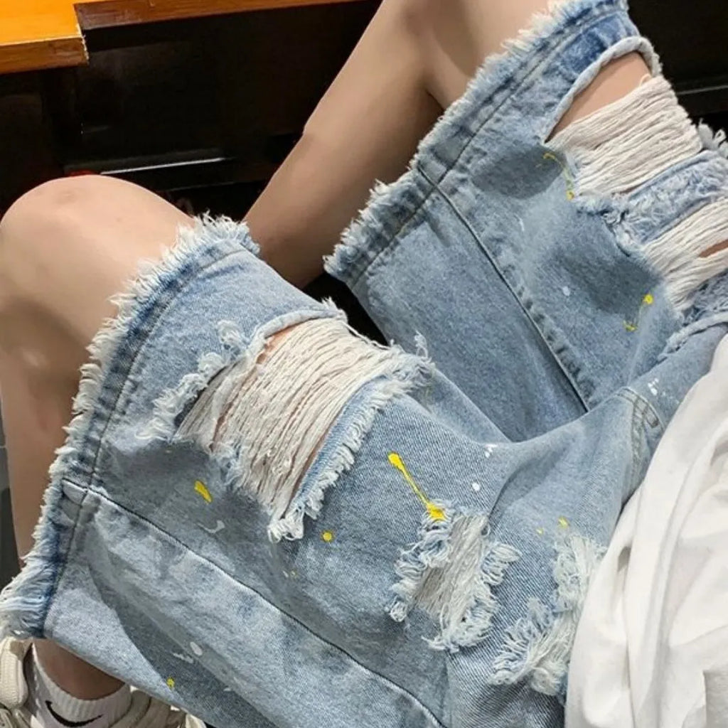 Men's water washed hole denim shorts in loose fit street style