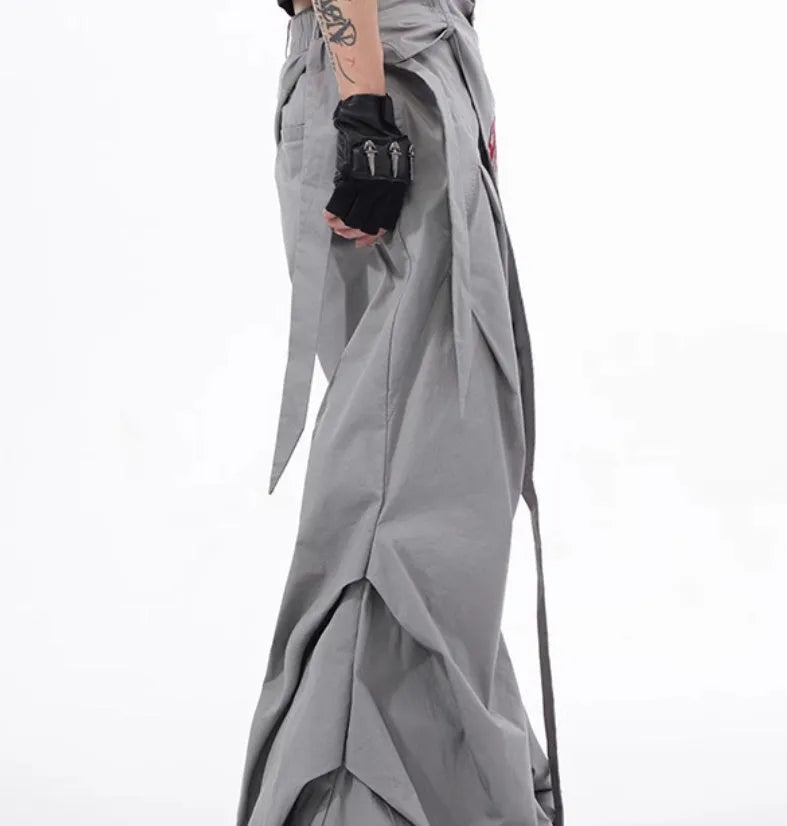 Boy wearing black wide-leg Korean style summer trousers with an elasticated waistband.