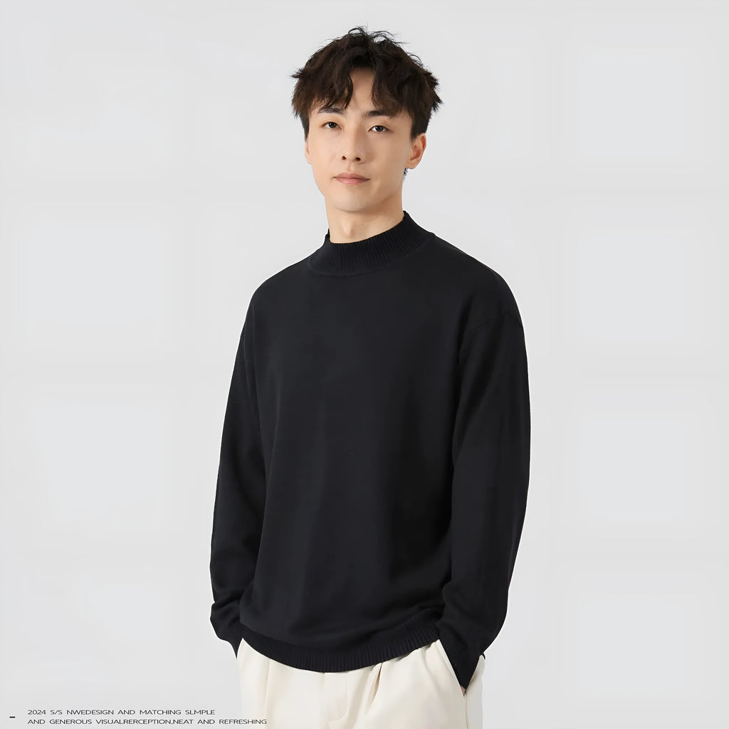 Man wearing a loose-fit army green long sleeve pullover sweater for casual autumn wear.