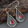Silver-coloured drop-shaped retro earrings made from zinc alloy.
