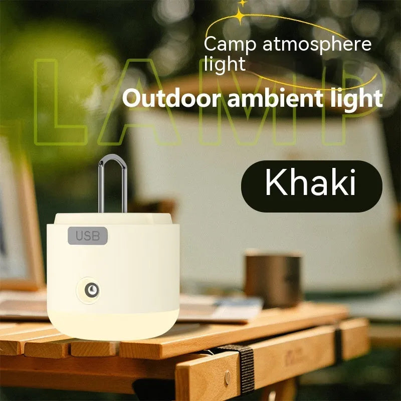 Compact USB rechargeable camping lantern in Misty White, 75x85mm, on outdoor background