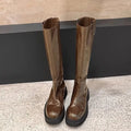 Women's black chunky heel knee-high knight boots with round toe and back zipper on a white background.