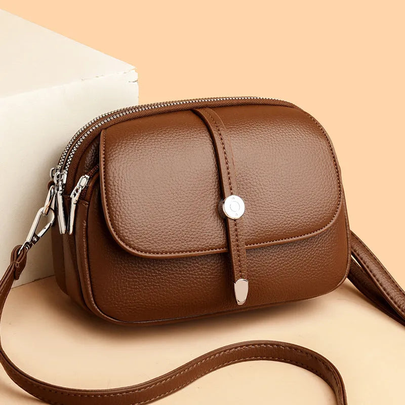 City Simple women's oval crossbody bag in soft PU leather available in black, khaki, or dark brown