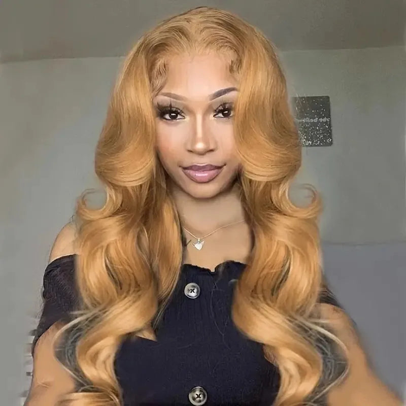 Light brown long curly synthetic wig with big waves and side bangs displayed on a stand.