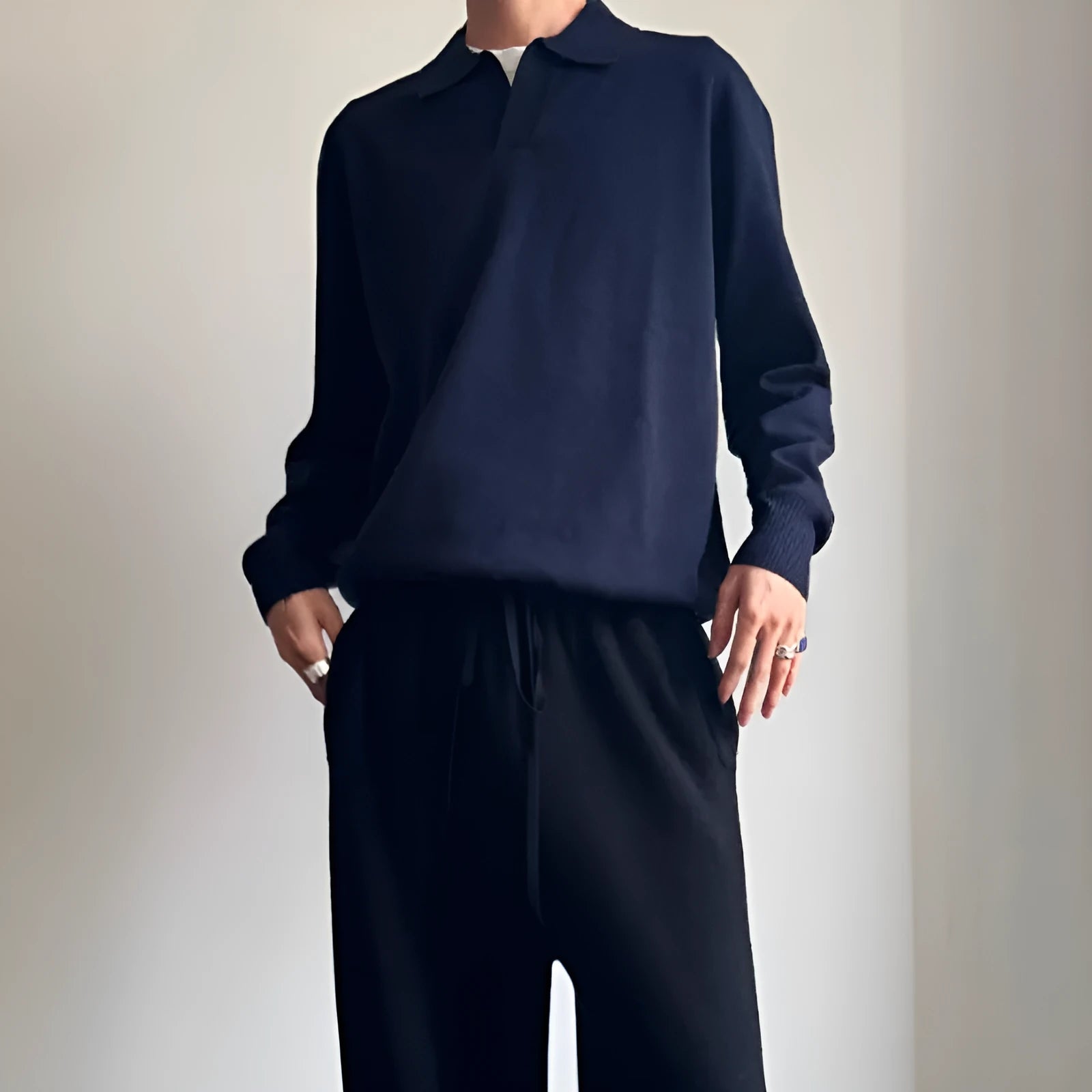 Pure wool polo sweater with lapel collar in loose fit, shown in navy blue colour.