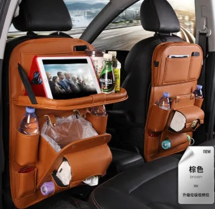 Black PU leather car storage hanging bag with multiple pockets on a car seat.