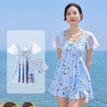 Women's sea salt blue floral one-piece polyester swimsuit on a hanger.