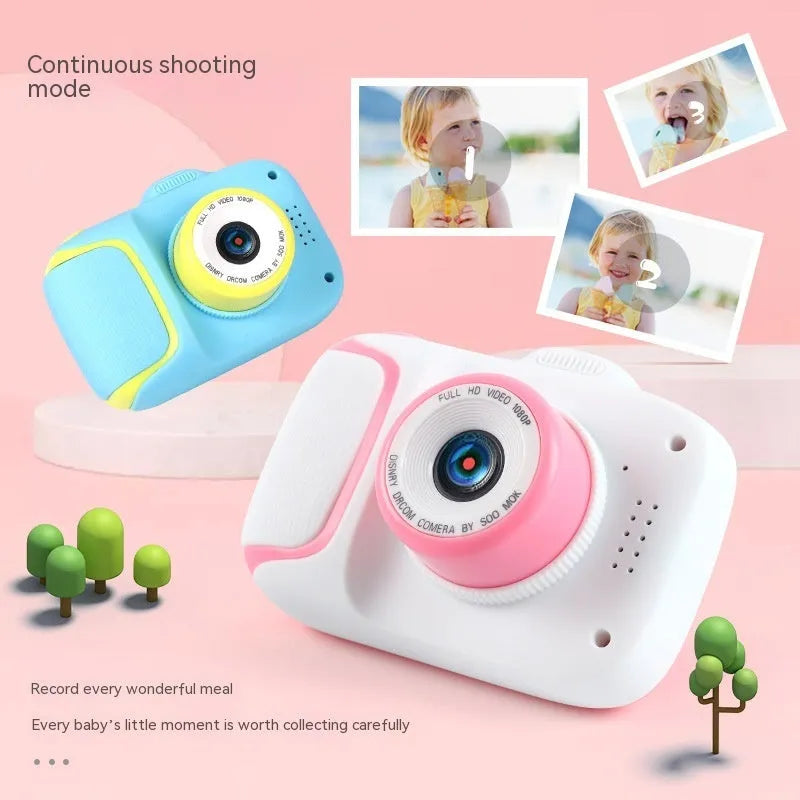 HD children's camera with 2.0 inch LCD screen in pink, showing video mode, with data cable and manual