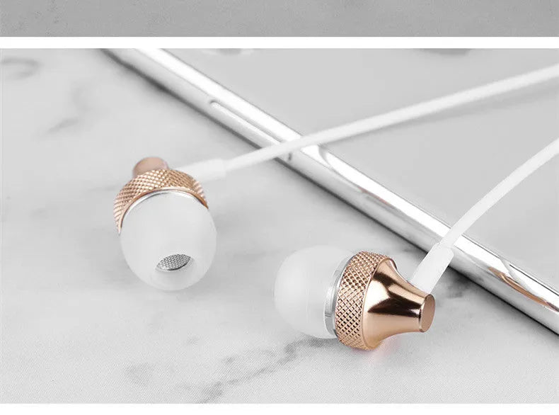 Gold metal in-ear headphones with a wheat-coloured cable and 3.5mm plug.