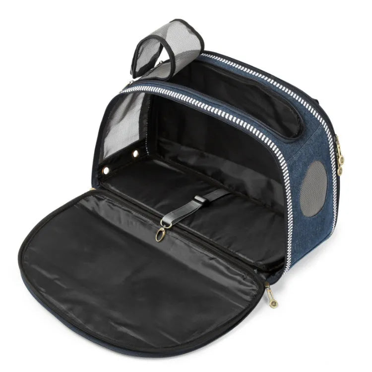 Blue denim pet carrier bag with cartoon pattern measuring 43cm by 20cm by 30cm