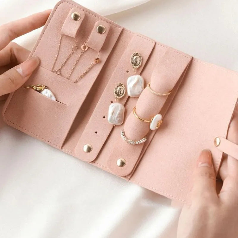 Soft brown leather jewellery storage pouch for earrings and rings, shown at 12cm square size.
