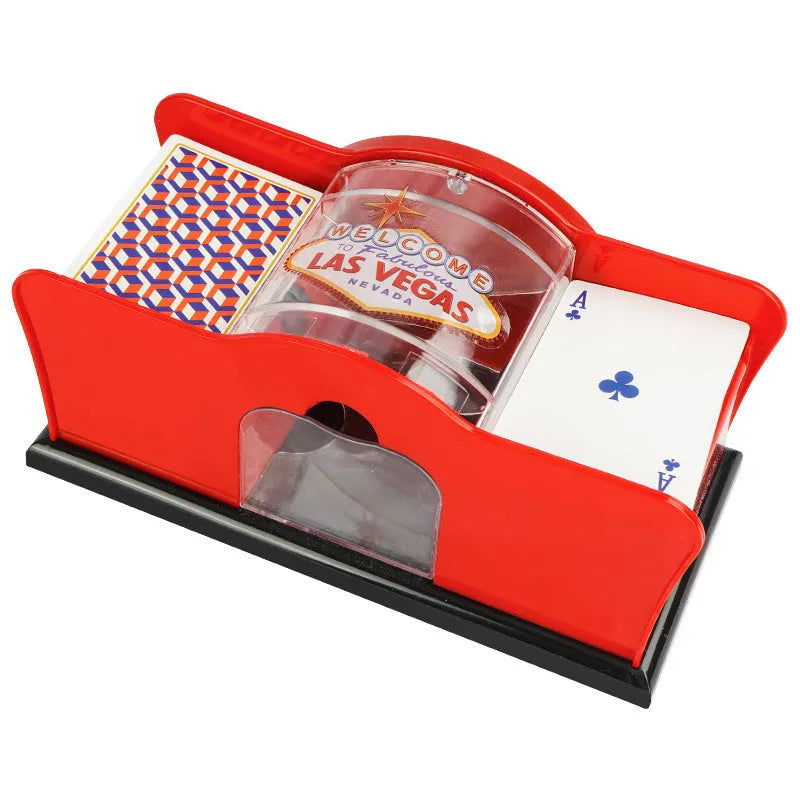 Black and red manual hand-crank card shuffler machine for casino games on a table.