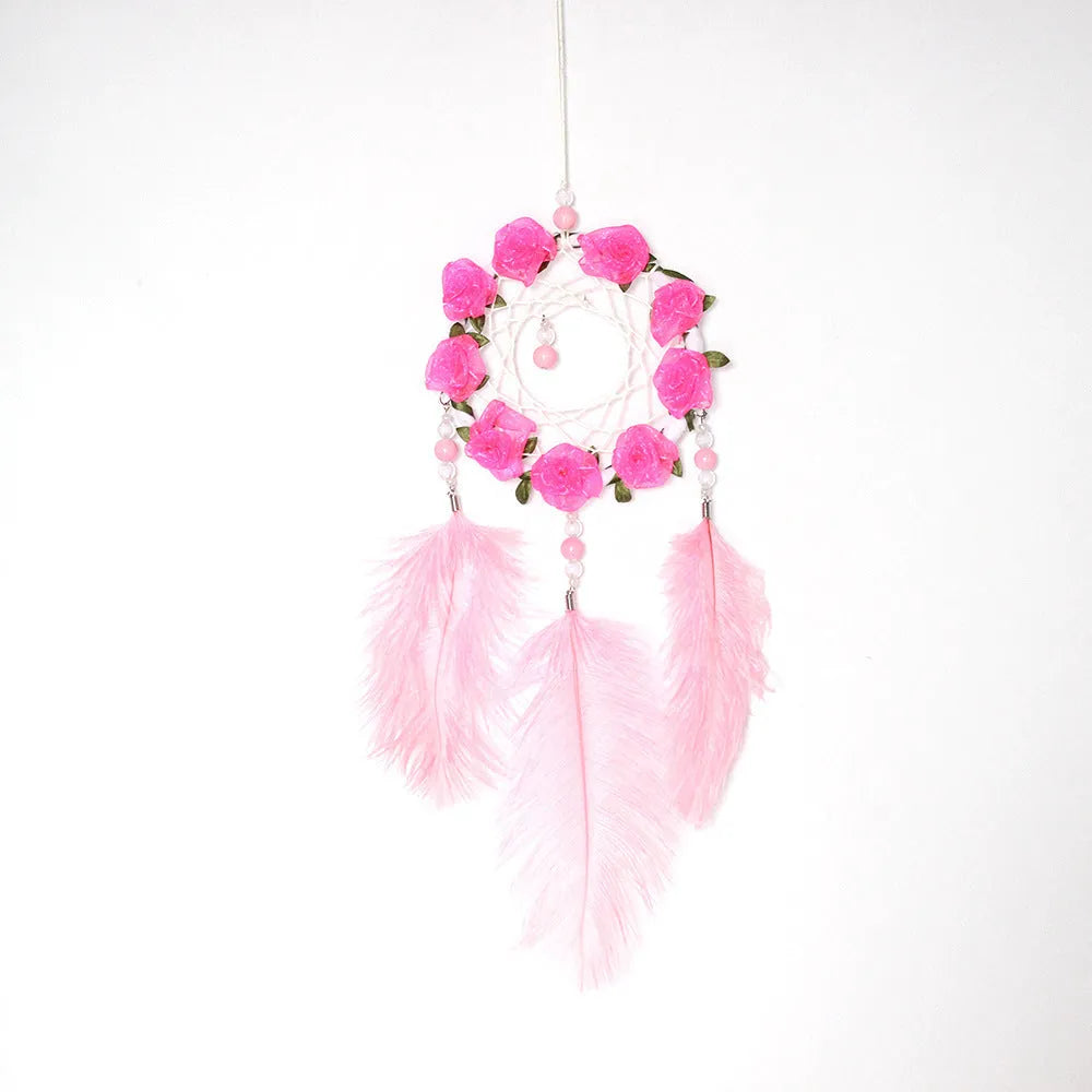 Pink ostrich feather dreamcatcher wind chime wall ornament measuring 10cm