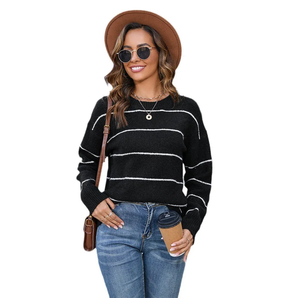Women's black and white striped pullover sweater with loose fit street fashion style