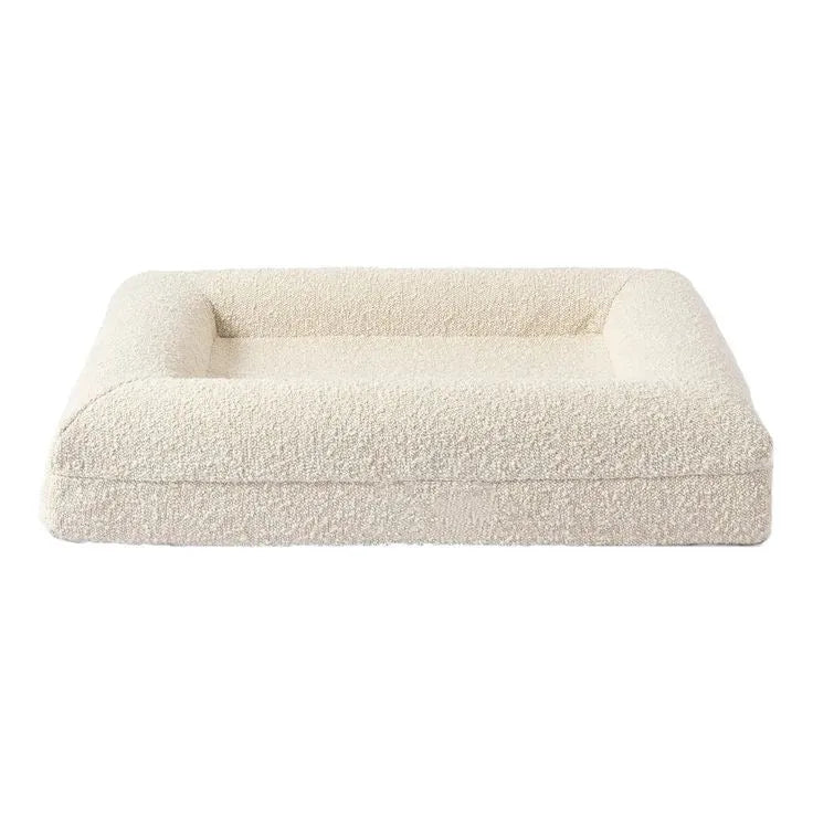 Beige rectangular cloth dog bed with low-profile sofa-style design