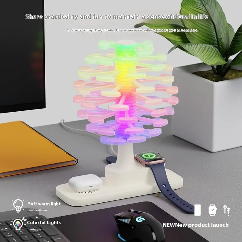 Modern geometric spiral tree shaped LED desk lamp on a wooden surface