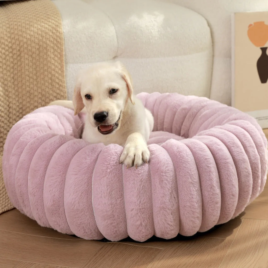 Round beige plush pet bed mat for dog or cat on wooden floor
