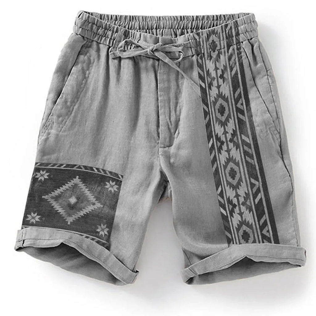 Man wearing blue colour block print loose casual shorts with lace-up waist.