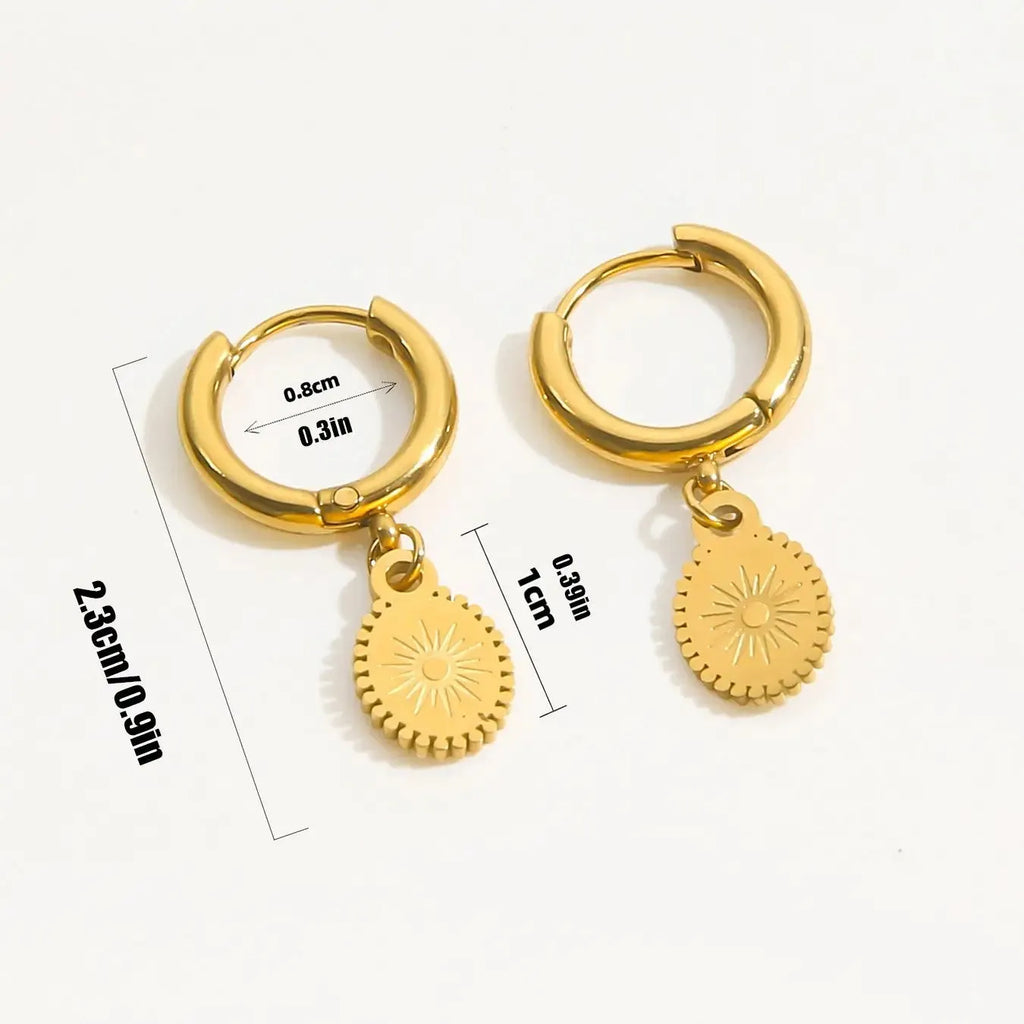 A pair of stainless steel ellipse-shaped stud earrings with butterfly clips on a white background.