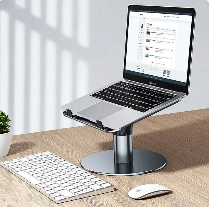Silver aluminium car laptop stand with height adjustment and 360-degree rotating base on a car seat.